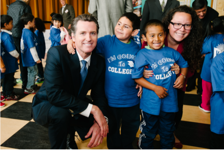 Newsom with school children